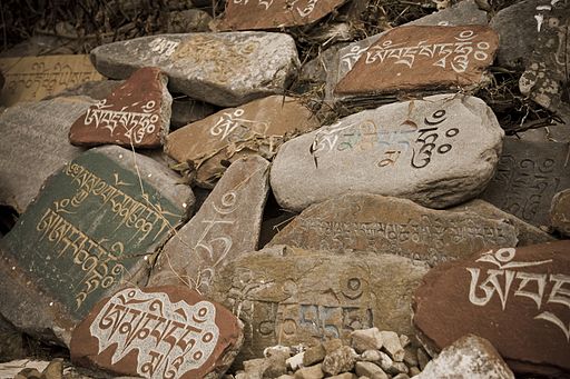 Stone tablets with prayers in Tibetan language at a Temple in McLeod Ganj